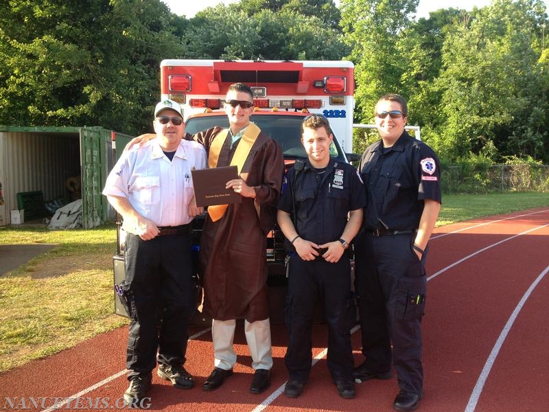 Jake Conlon, a CSHS graduate takes a picture with the standby crew after the graduation. Photo: Nanuet EMS
